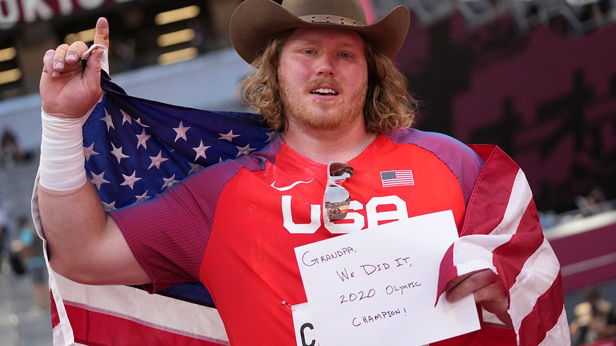 Ryan Crouser, of United States, celebrates after winning the final of the men's shot put at the 2020 Summer Olympics