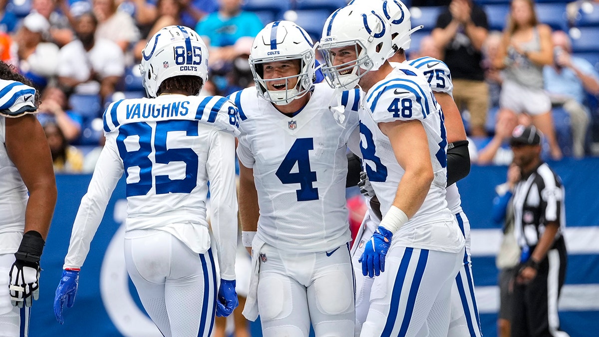 Indianapolis Colts quarterback Sam Ehlinger (4) celebrates after a two-point conversion against the Carolina Panthers during the second half of an NFL football game in Indianapolis, Sunday, Aug. 15, 2021. (AP Photo/AJ Mast)