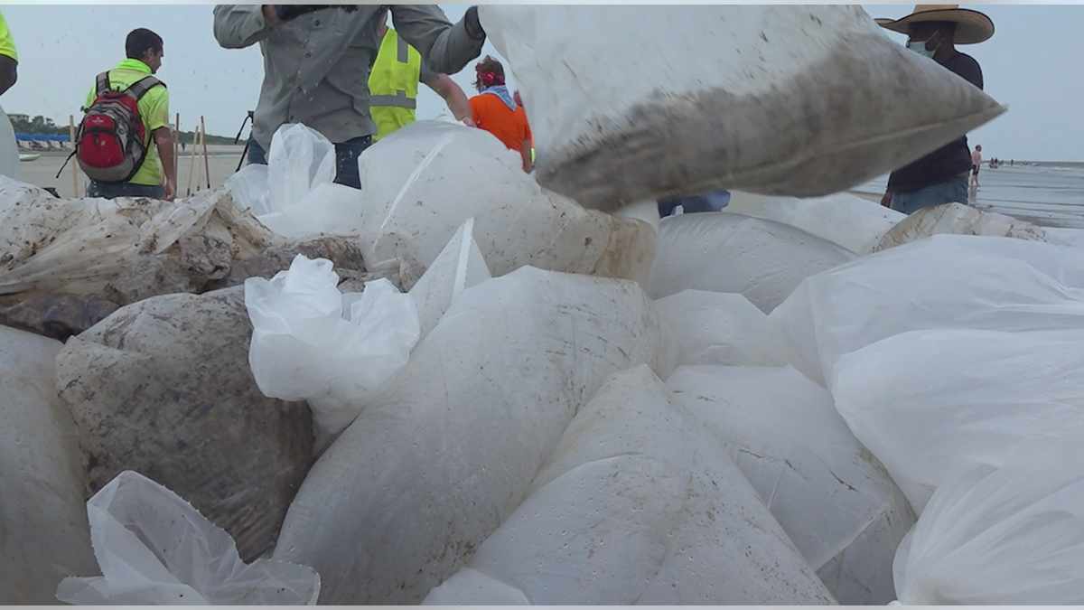 Clean up crews quickly started removing oily sand from the beaches. (Jayla Whitfield/FNC)