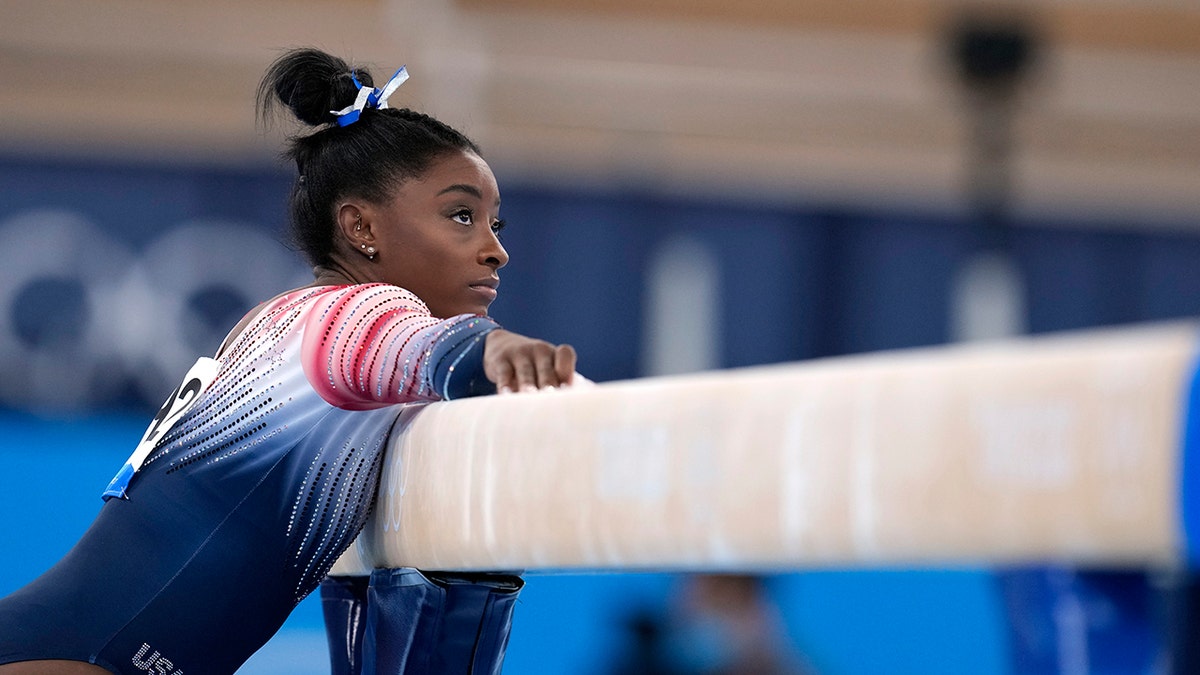 Simone Biles, of the United States, preparers to perform on the balance beam during the artistic gymnastics women's apparatus final at the 2020 Summer Olympics, Tuesday, Aug. 3, 2021, in Tokyo, Japan.