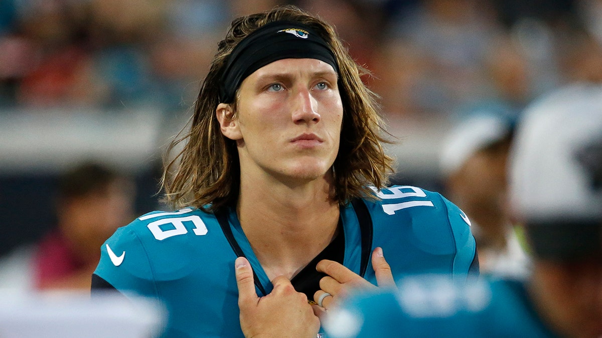 Jacksonville Jaguars quarterback Trevor Lawrence looks up at the scoreboard during the first half of an NFL preseason football game against the Cleveland Browns, Saturday, Aug. 14, 2021, in Jacksonville, Fla. (AP Photo/Stephen B. Morton)