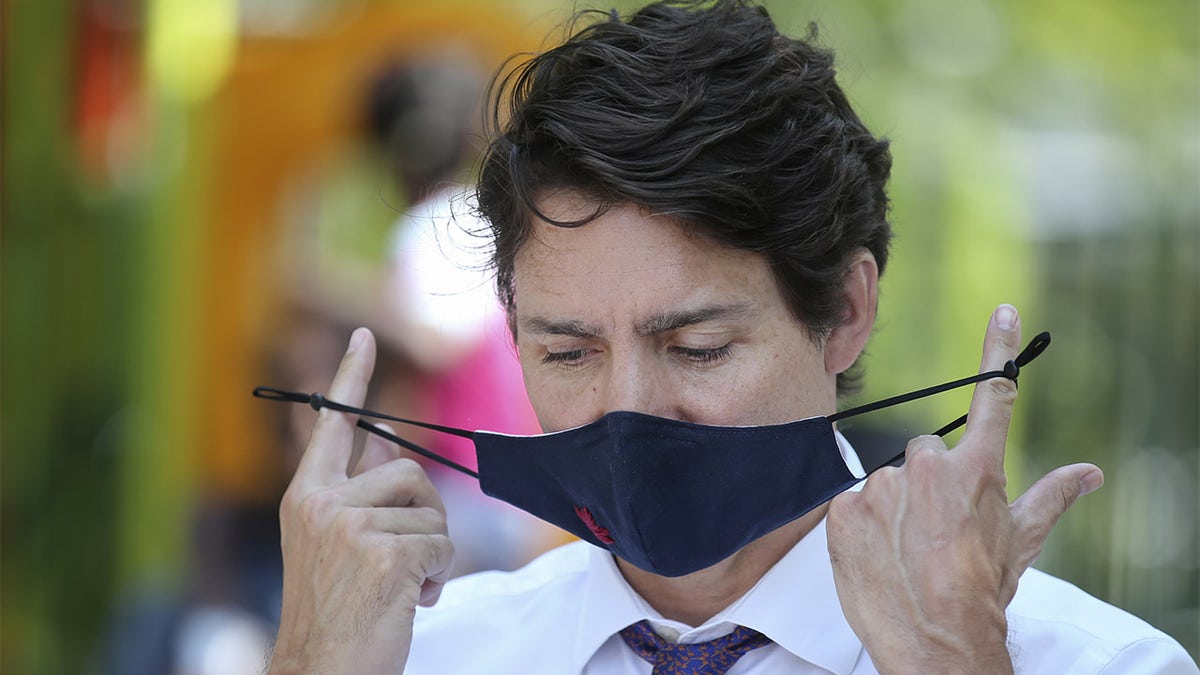 Justin Trudeau, Canada's prime minister puts on face mask