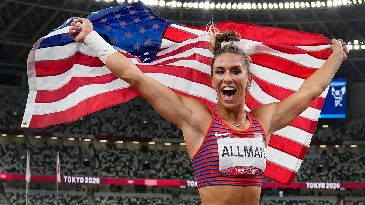 Valarie Allman, of the United States, poses after winning the gold medal in the women's discus throw final at the 2020 Summer Olympics