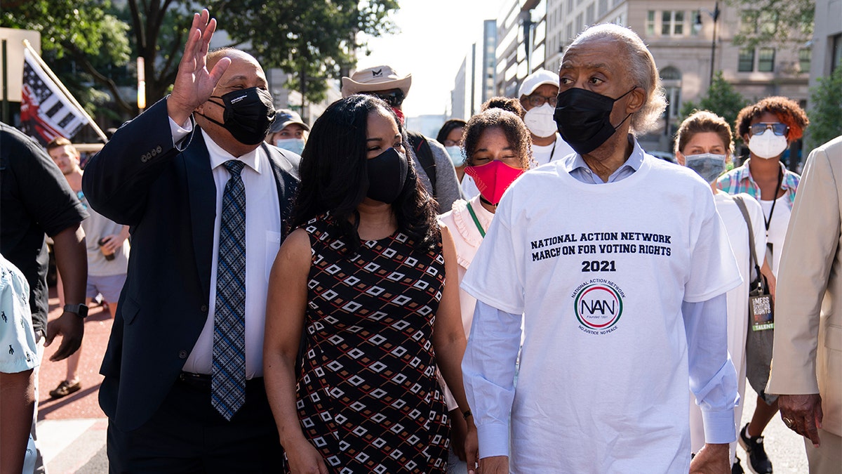 The Rev. Al Sharpton, right, with Martin Luther King, III, left, walk during a march for voting rights, marking the 58th anniversary of the March on Washington, Saturday, Aug. 28, 2021, in Washington. (Associated Press)