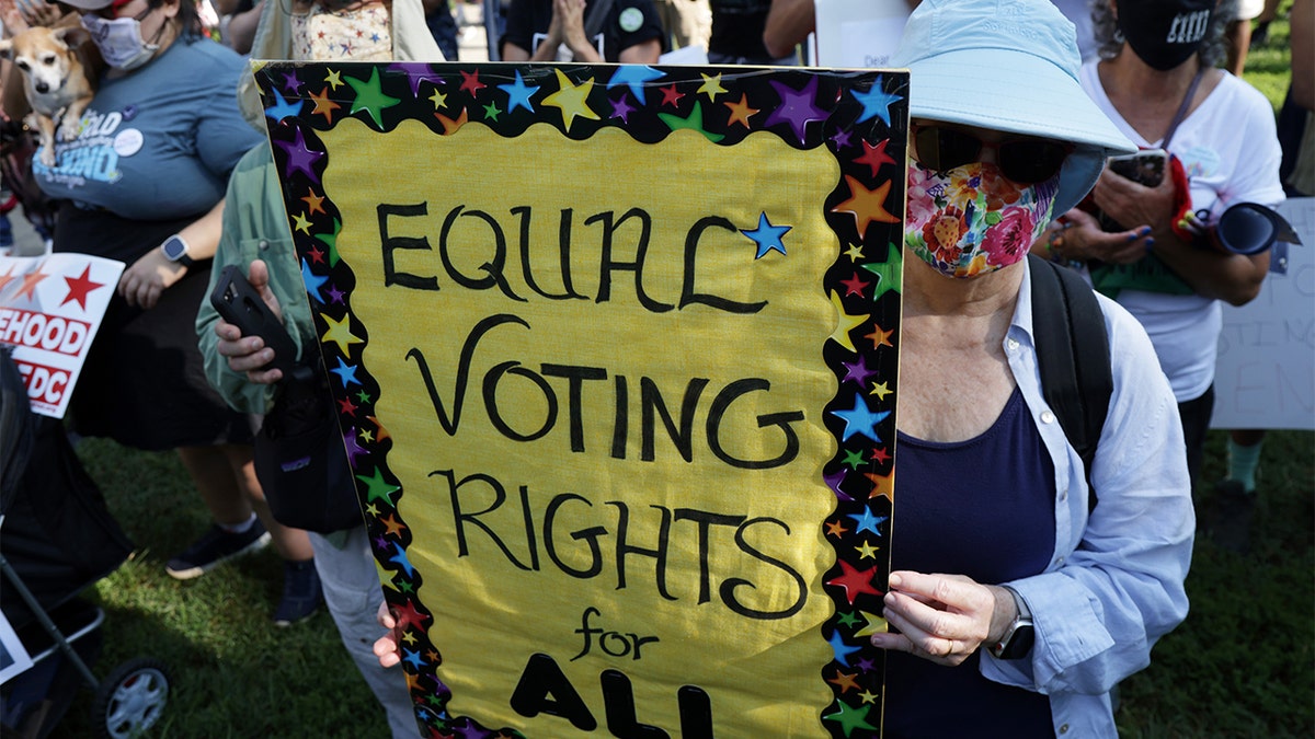 Voting rights activists participate in a pre-march rally during a March On For Voting Rights event at McPherson Square Aug. 28, 2021, in Washington, D.C.