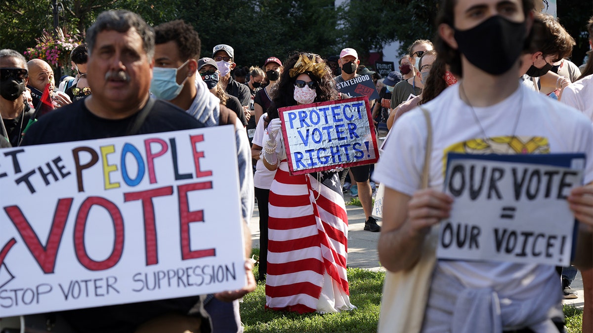 Voting rights activist Regina Cosio of Syracuse, New York, dresses as "Ms. Liberty" as she participates in a pre-march rally during a March On For Voting Rights event at McPherson Square Aug. 28, 2021 in Washington, DC. (Getty Images)