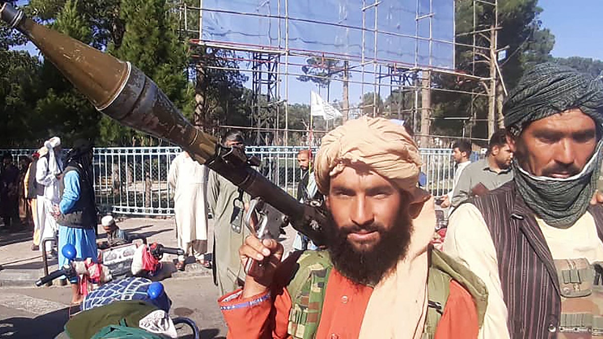 A Taliban fighter holds a rocket-propelled grenade along the roadside in Herat, Afghanistan's third biggest city, on Friday. (Photo by AFP via Getty Images)