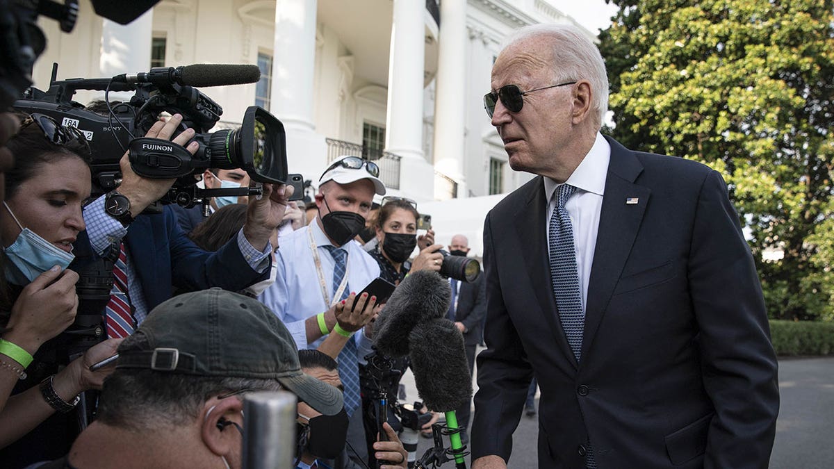 President Biden speaks to reporters outside White House