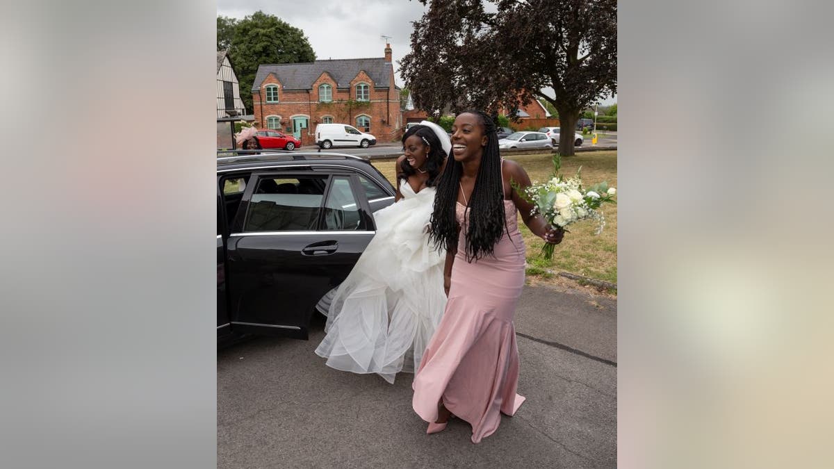 Shenice Beirne (left), her sister Siobahn Ellis (right) and their mother Gloria (back) had to hitchhike to make it to Beirne's wedding ceremony in Gloucester, England. 