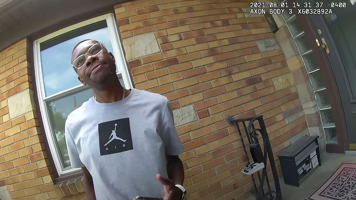 This Aug. 1, 2021 image from video provided by the Wyoming Police Department shows real estate agent Eric Brown outside a home he was showing to a potential buyer in Wyoming, Michigan.
