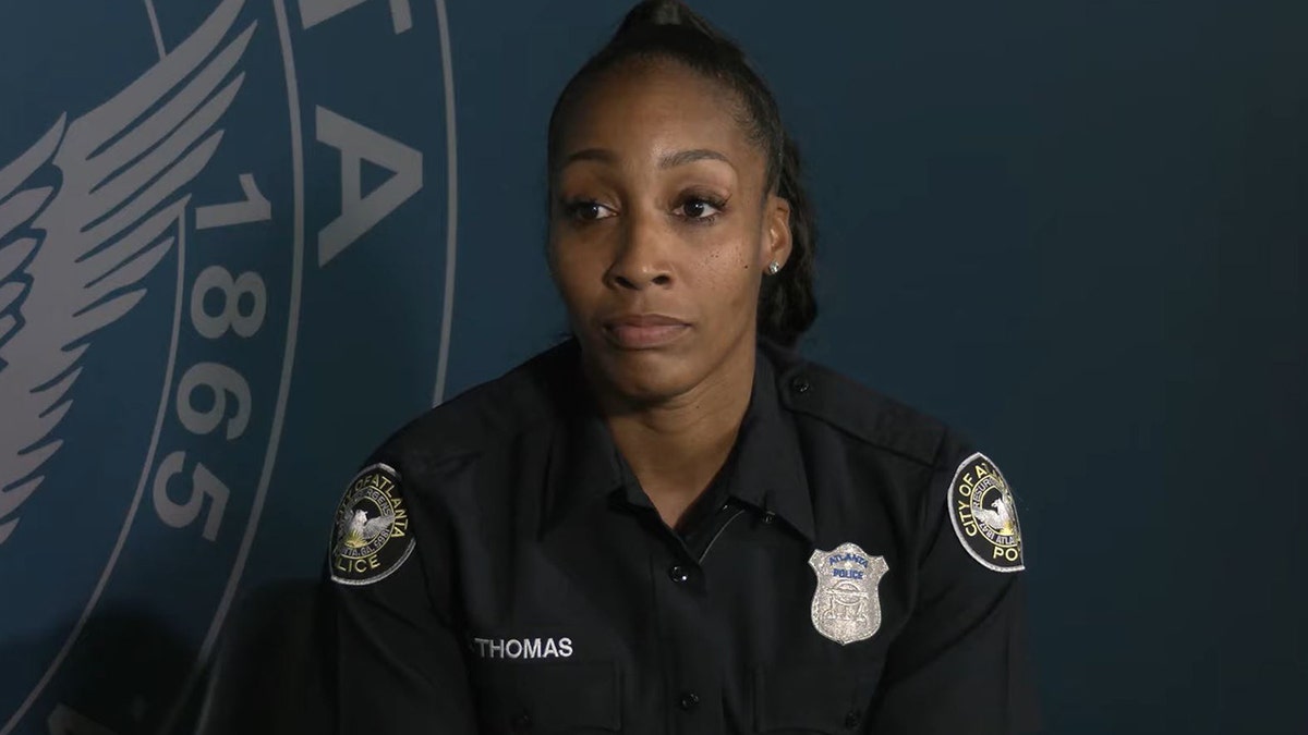 An Atlanta police officer who was unknowingly caught on camera giving a barefoot homeless man a pair of shoes described what led her to perform the act of kindness.