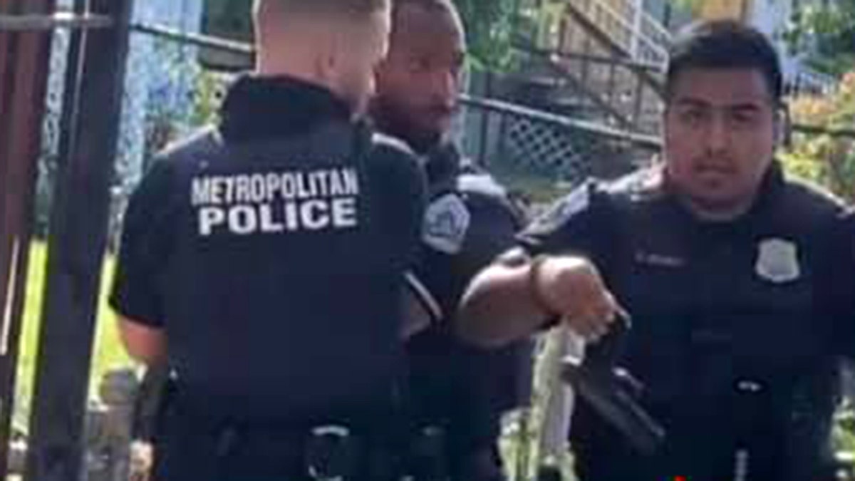 Bystander video shows an officer holding the handgun recovered from a suspect’s waistband. Earlier in the viral clip, two officers are seen restraining the suspect, as a third officer was punching him in the face. 