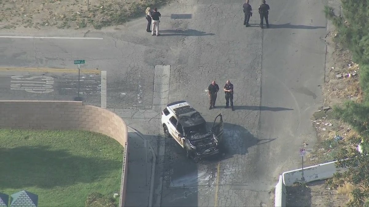 A San Bernardino County Sheriff's deputy was shot Tuesday while trying to make a traffic stop, authorities said. His patrol vehicle was found torched at the scene. 