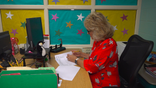 Special education teacher Susan McDermott prepares her classroom at Davis Drive Elementary School for the 2021-22 school year.
