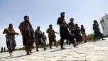 FILE - In this Aug. 19, 2021, file photo, Taliban fighters patrol in Kabul, Afghanistan. After the Taliban takeover, employees of the collapsed government, civil society activists and women are among the at-risk Afghans who have gone into hiding or are staying off the streets. (AP Photo/Rahmat Gul, File)
