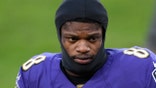 FILE - Baltimore Ravens quarterback Lamar Jackson (8) stands on the field after an NFL football game against the New York Giants in Baltimore, in this Sunday, Dec. 27, 2020, file photo. Lamar Jackson was not practicing with the Baltimore Ravens at the start of their first practice of training camp Wednesday, July 28, 2021. (AP Photo/Nick Wass, File)