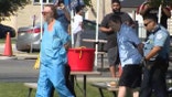 Two brothers have been taken into custody Saturday after police discovered two bodies buried in the backyard of a home in Lyons, Illinois (Photo courtesy of FOX 32)