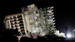 FILE PHOTO: The partially collapsed Champlain Towers South residential building is demolished, in Surfside, Florida, July 4, 2021. REUTERS/Marco Bello/File Photo