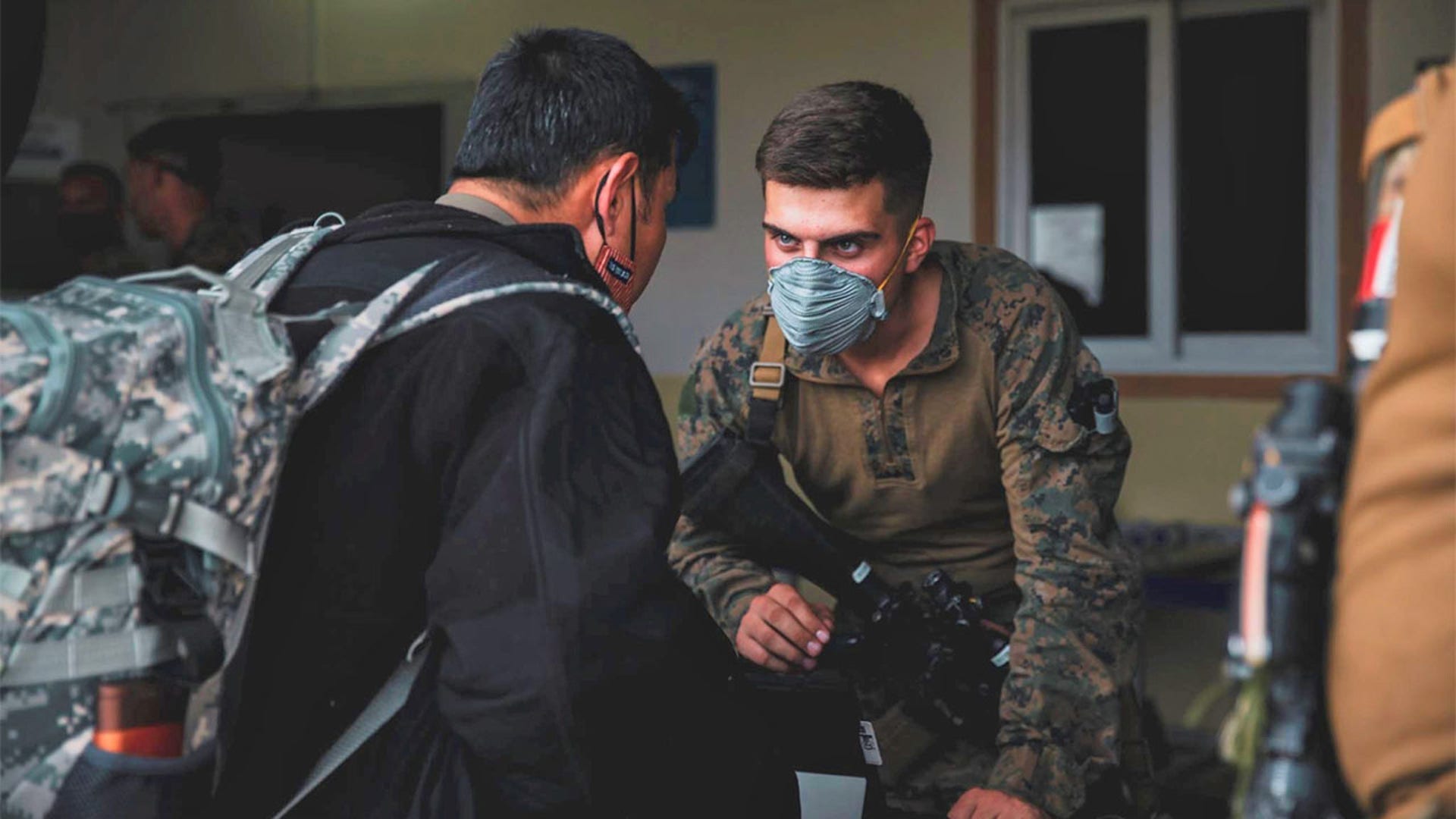 U.S. Marines from the@24thMEUMarinesprocess@StateDeptpersonnel and civilians at Hamid Karzai International Airport in Kabul, Afghanistan, before departing.