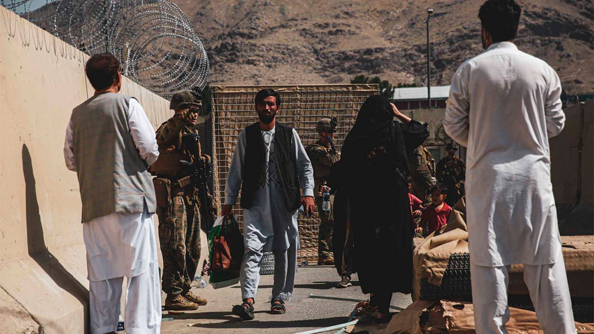 Marines with the@24thMEUMarineshand out water and process civilians for evacuation at Hamid Karzai International Airport in Kabul, Afghanistan. The Department is working closely with the@StateDeptand partners &amp; allies to process eligible civilians.
