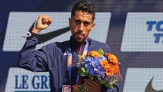 French Olympics runner defends knocking over 'slippery' water bottles during marathon event