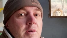 Lion stares, growls at nature guide from outside a kitchen window: video