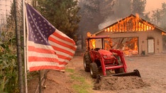 California wildfire threatens homes as blazes burn across West