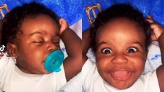 Baby gets woken by his parents and his reaction is stunning