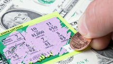 Woman wins $1 million in lottery after canceled flight left her looking to 'pass the time'