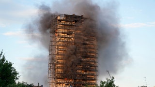 Frantic rescue as fire engulfs 20-story apartment building