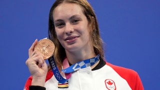 Swimmer who won 3 medals in Tokyo sends message to high school teacher who tried to kill her dreams