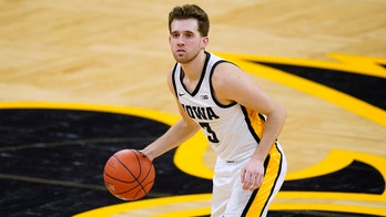 Former football player charged in Iowa hoops star's assault