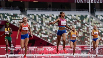 McLaughlin outsprints teammate Muhammad for hurdles record