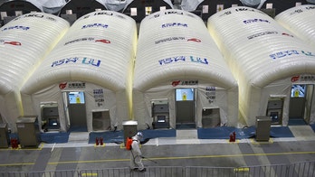 China seals city as its worst virus outbreak in a year grows