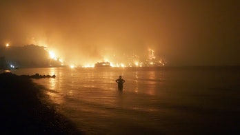 Fires rampage through forests in Greece; thousands evacuated