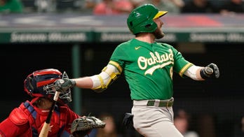 Lowrie doubles in 10th, A's top Indians for 5th win in row