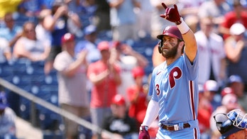 Harper, Phillies hold off Dodgers 2-1 to avoid sweep