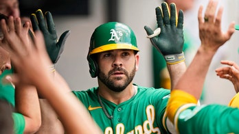 Moreland 2 HRs, Bassitt AL-high 12th W, A's bop Indians 17-0