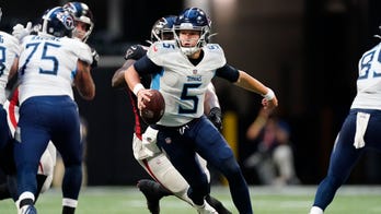 Woodside, Barkley throw TDs as Titans stop Falcons 23-3