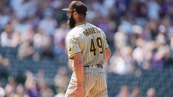 Arrieta rocked by Rockies, injured in Padres debut
