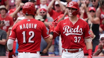 Naquin homers twice, Reds beat Marlins 3-1 to sweep series