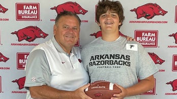 13-year-old college football hopeful hangs billboard to grab attention of Arkansas Razorbacks coach