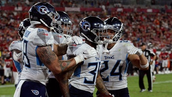 Titans defense shuts down Brady-less Buccaneers 34-3