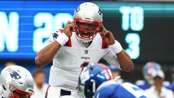 Cam Newton chases Mac Jones for high-five as Patriots' quarterback competition nears end