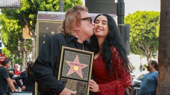 American Pie singer Don McLean, 75, kisses girlfriend Paris Dylan, 27, while receiving Walk of Fame star