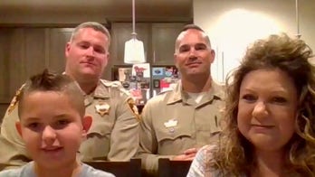 Las Vegas boy escorted to first day of school by police after father's death from COVID