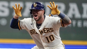 Brewers rally for 4 in 7th, beat Reds 7-4 to increase lead