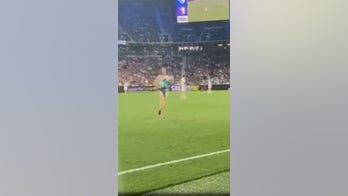 Mom tackles 2-year-old that ran onto soccer field mid-game, carries him to safety