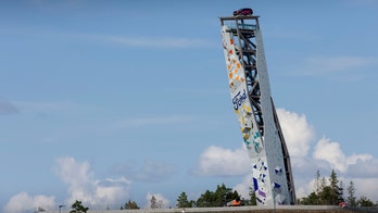 Climber scales tower to win free Ford Explorer parked on top