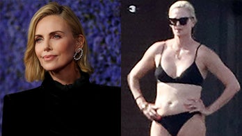 Charlize Theron soaks up some sun in black bikini while yachting in Greece